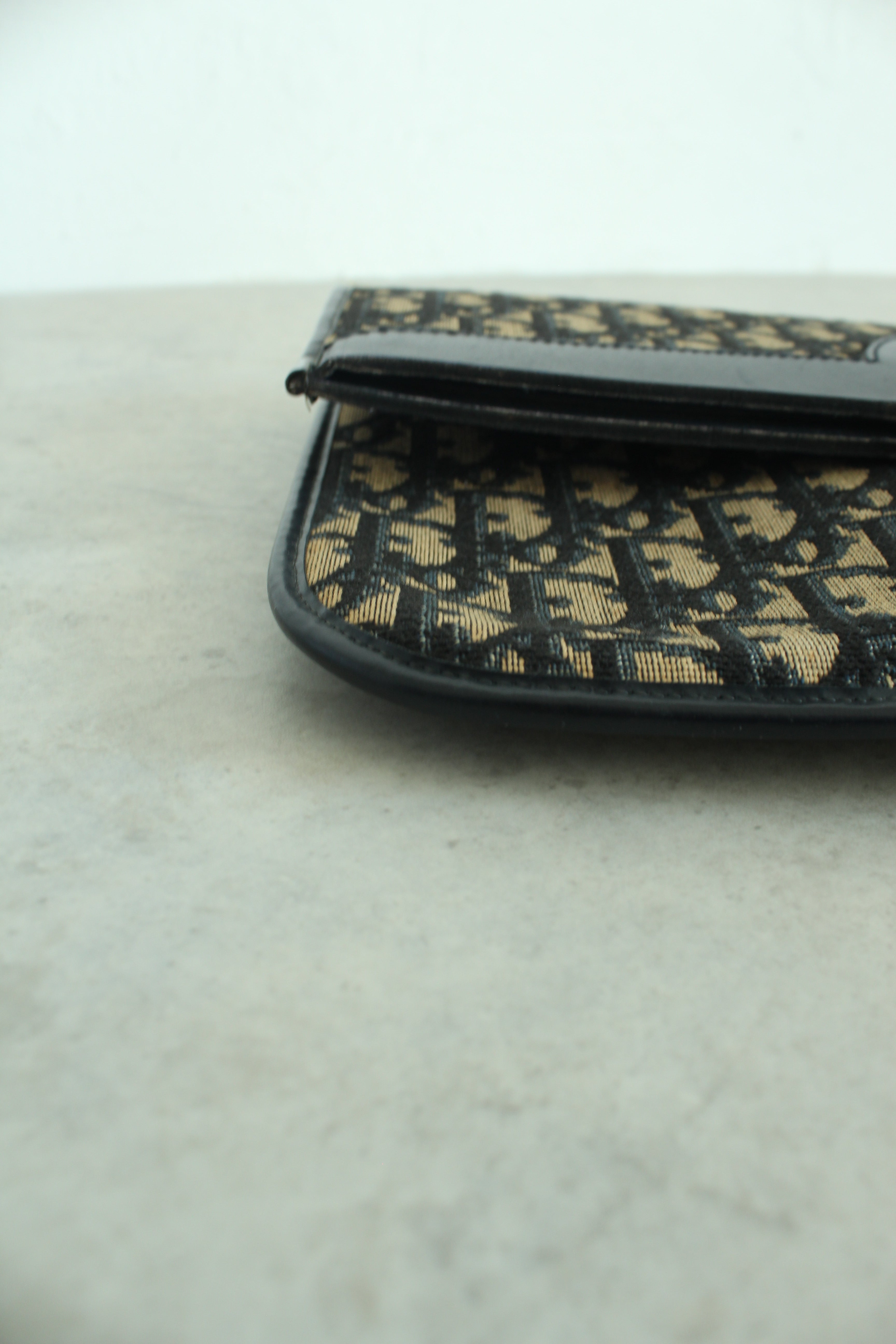 Oblique Fold over clutch in navy blue