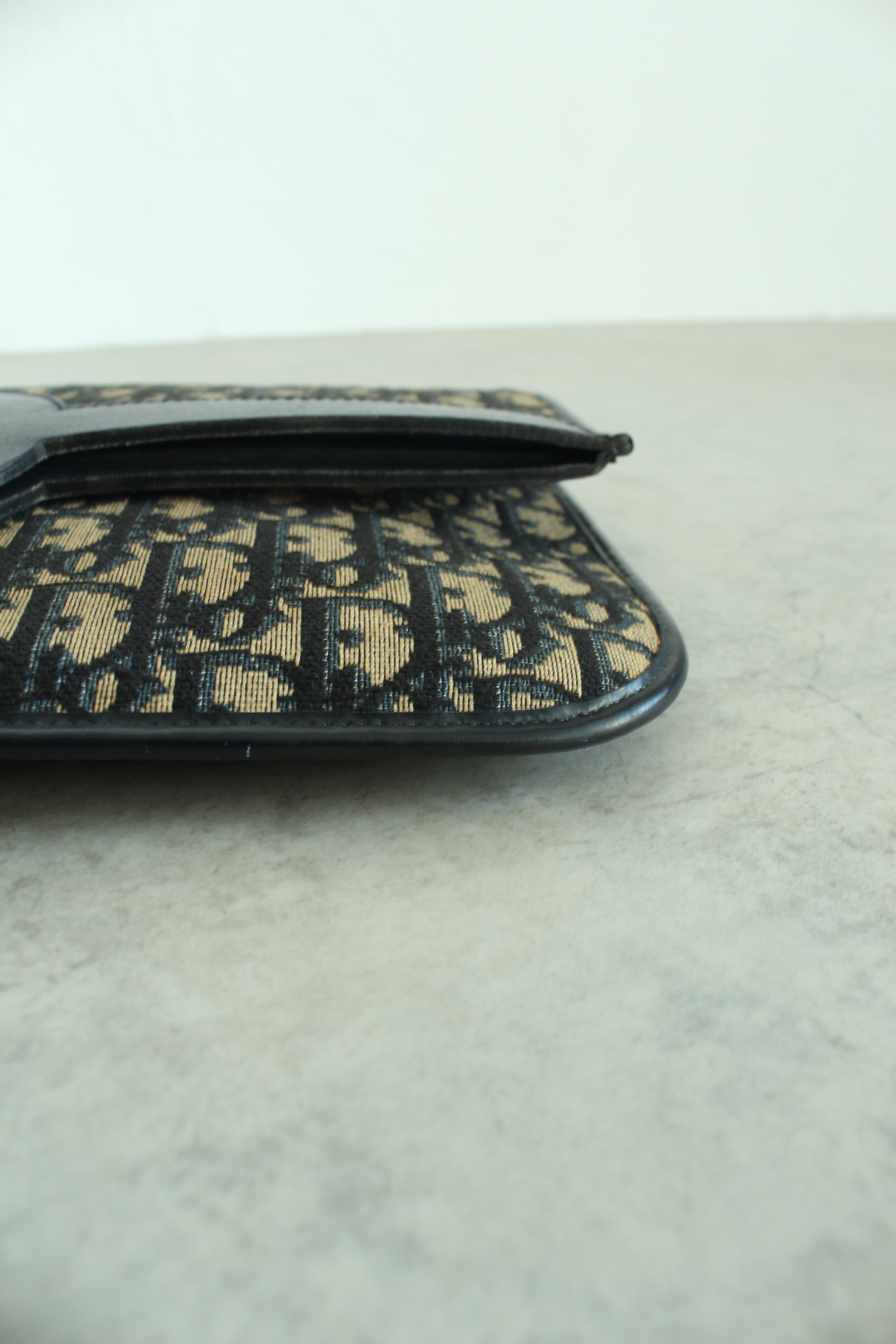 Oblique Fold over clutch in navy blue