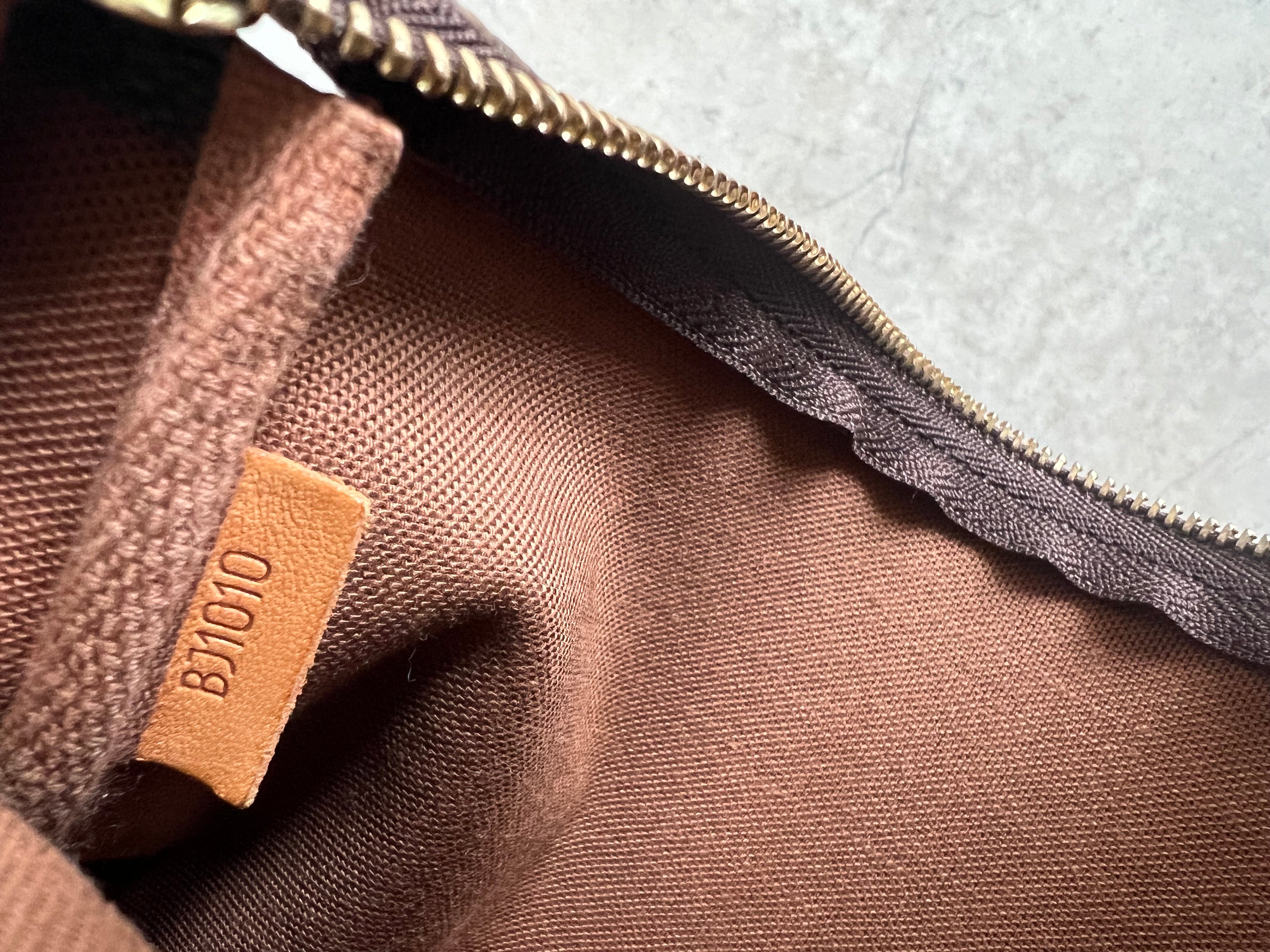 Pochette Accessoires Monogram Canvas (M82766)