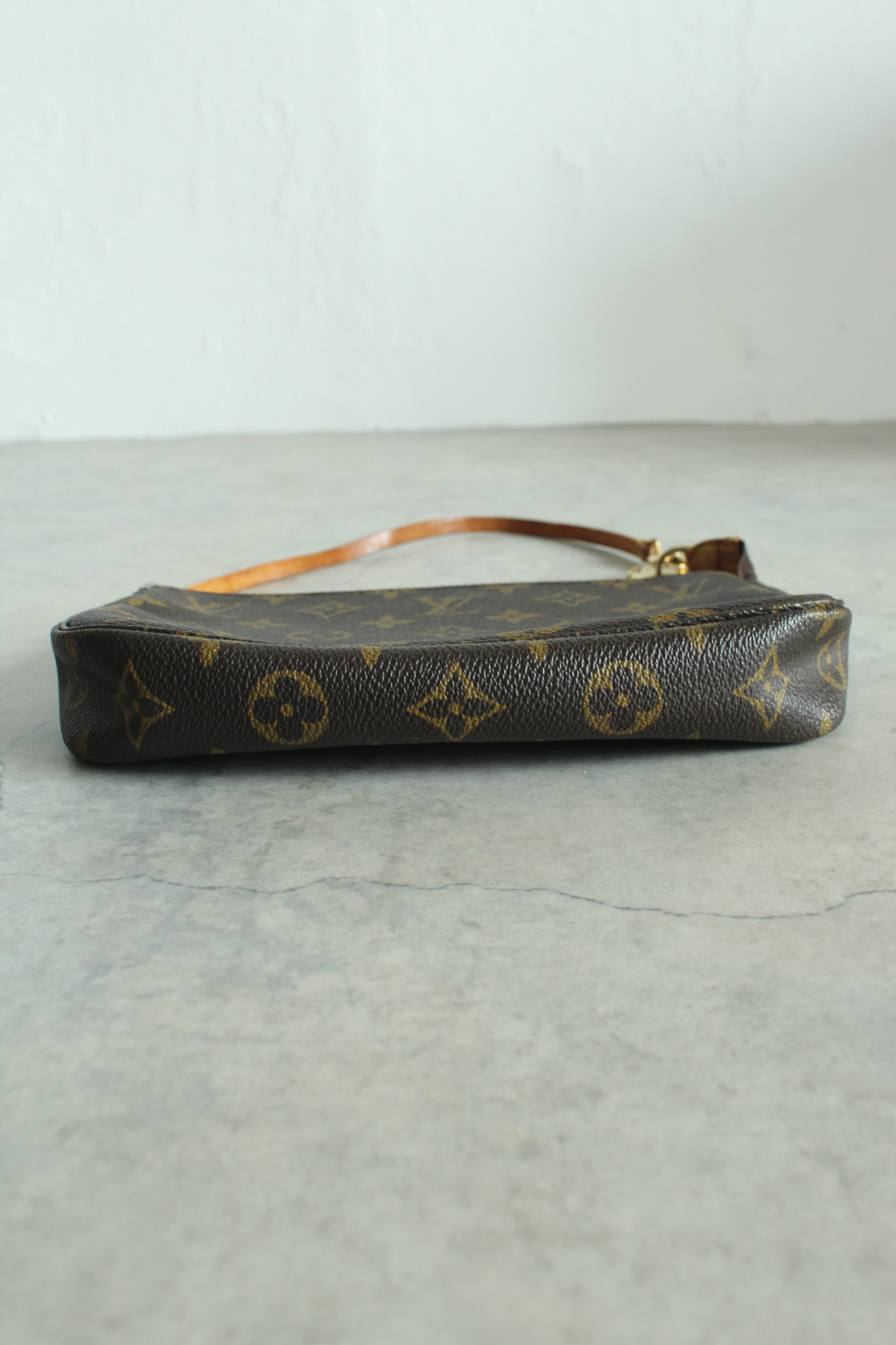 Pochette Accessoires Monogram Canvas (M82766) with a bag charm