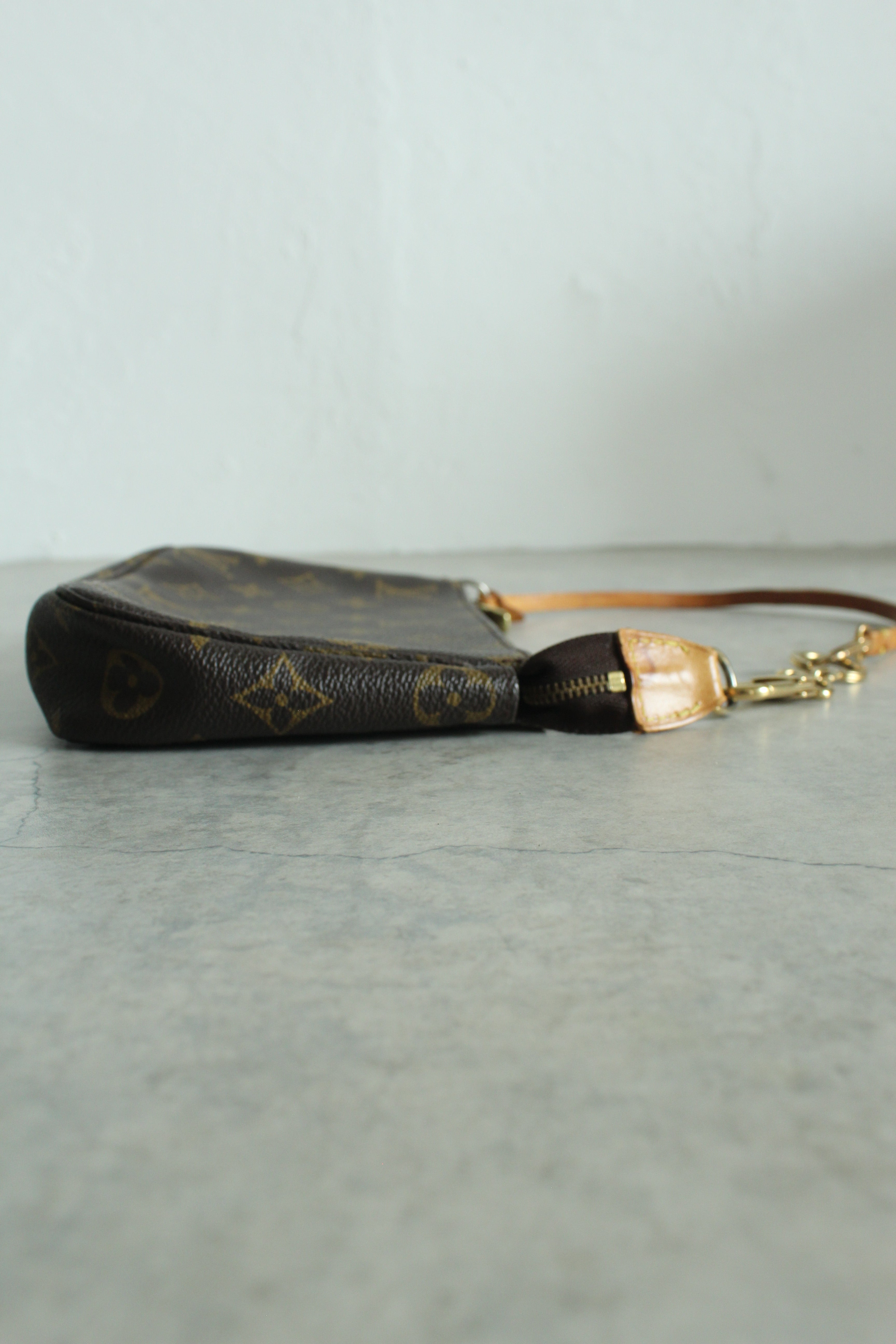 Pochette Accessoires Monogram Canvas (M82766) with a bag charm
