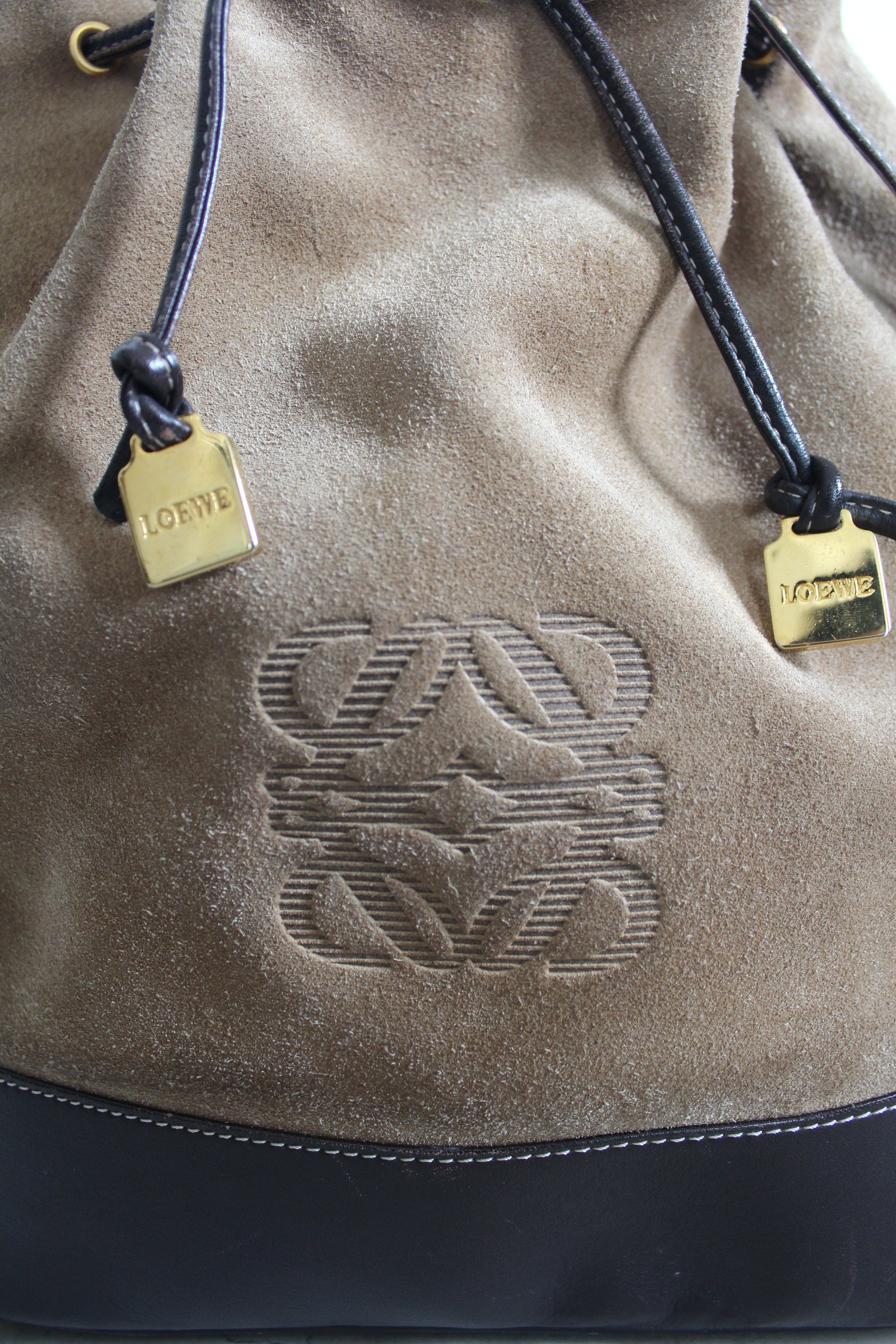 Anagram Suede Drawstring Bucket Bag