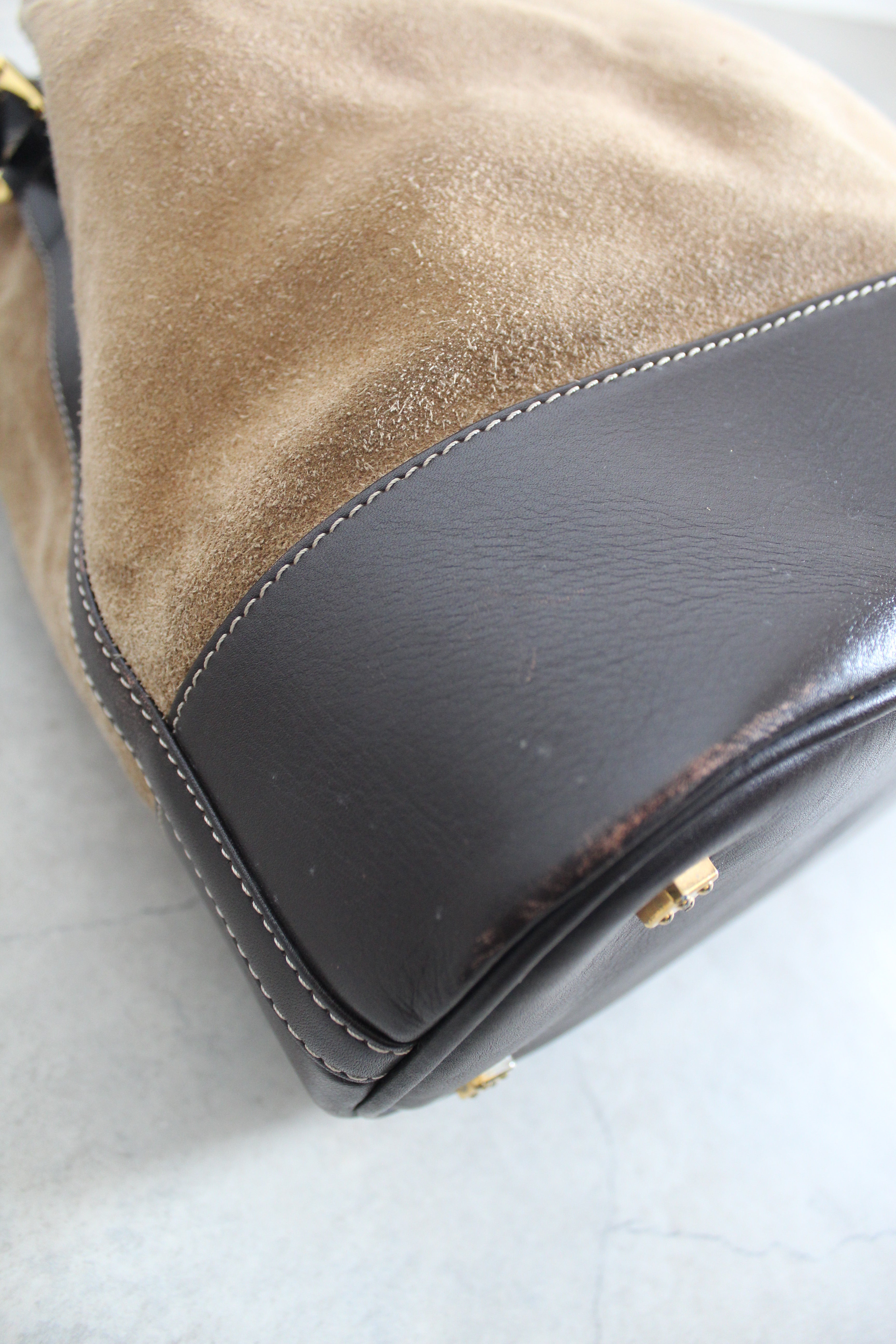 Anagram Suede Drawstring Bucket Bag
