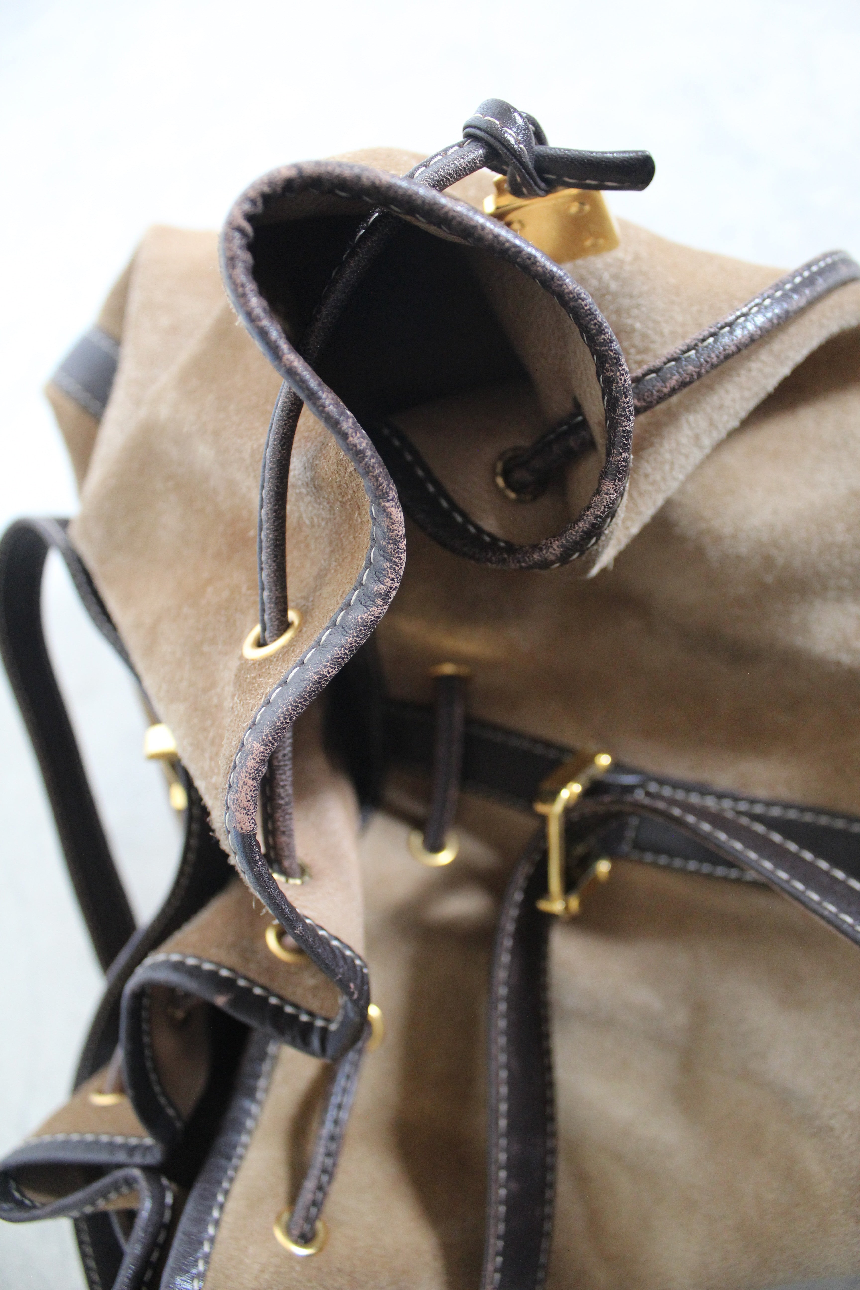 Anagram Suede Drawstring Bucket Bag
