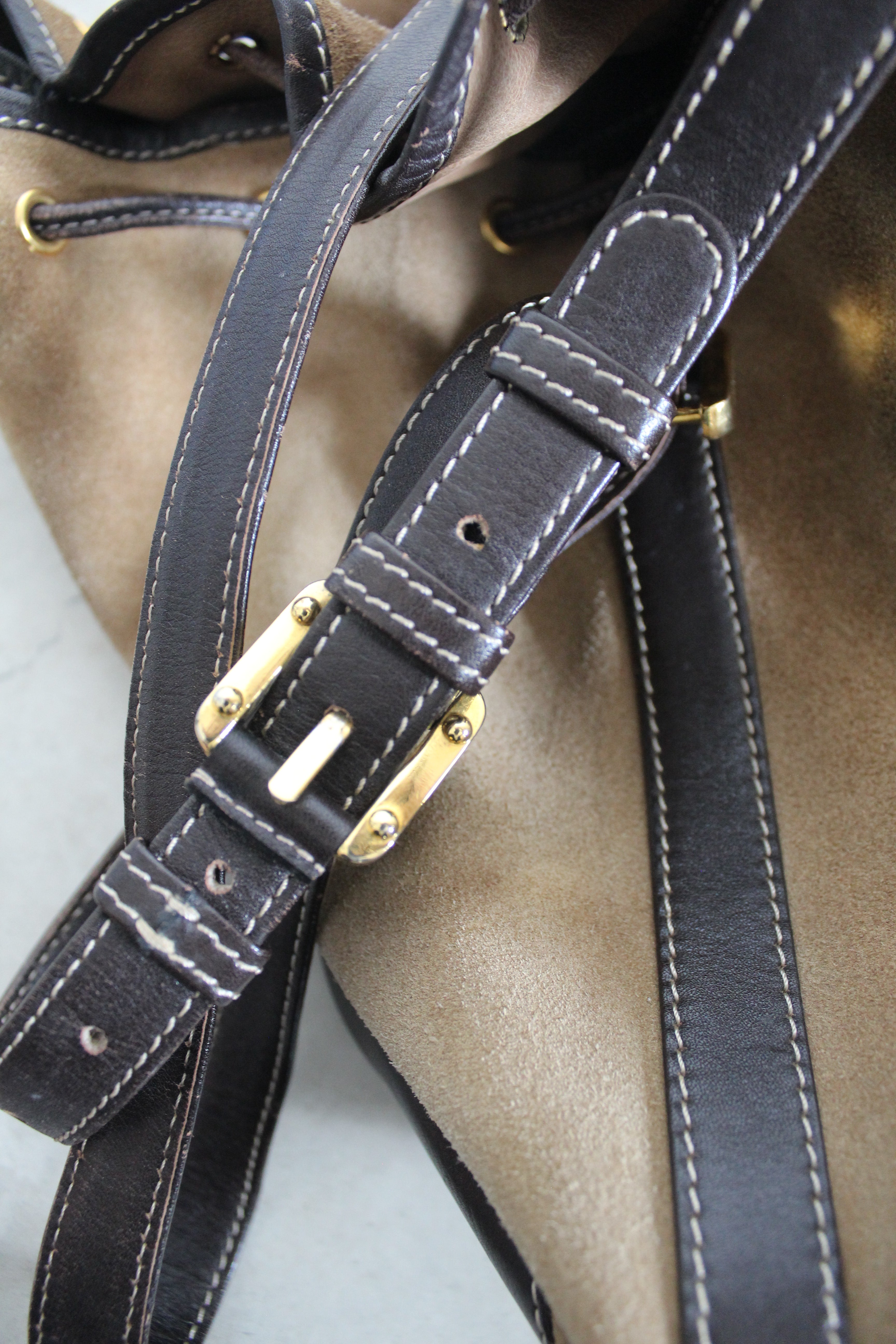 Anagram Suede Drawstring Bucket Bag