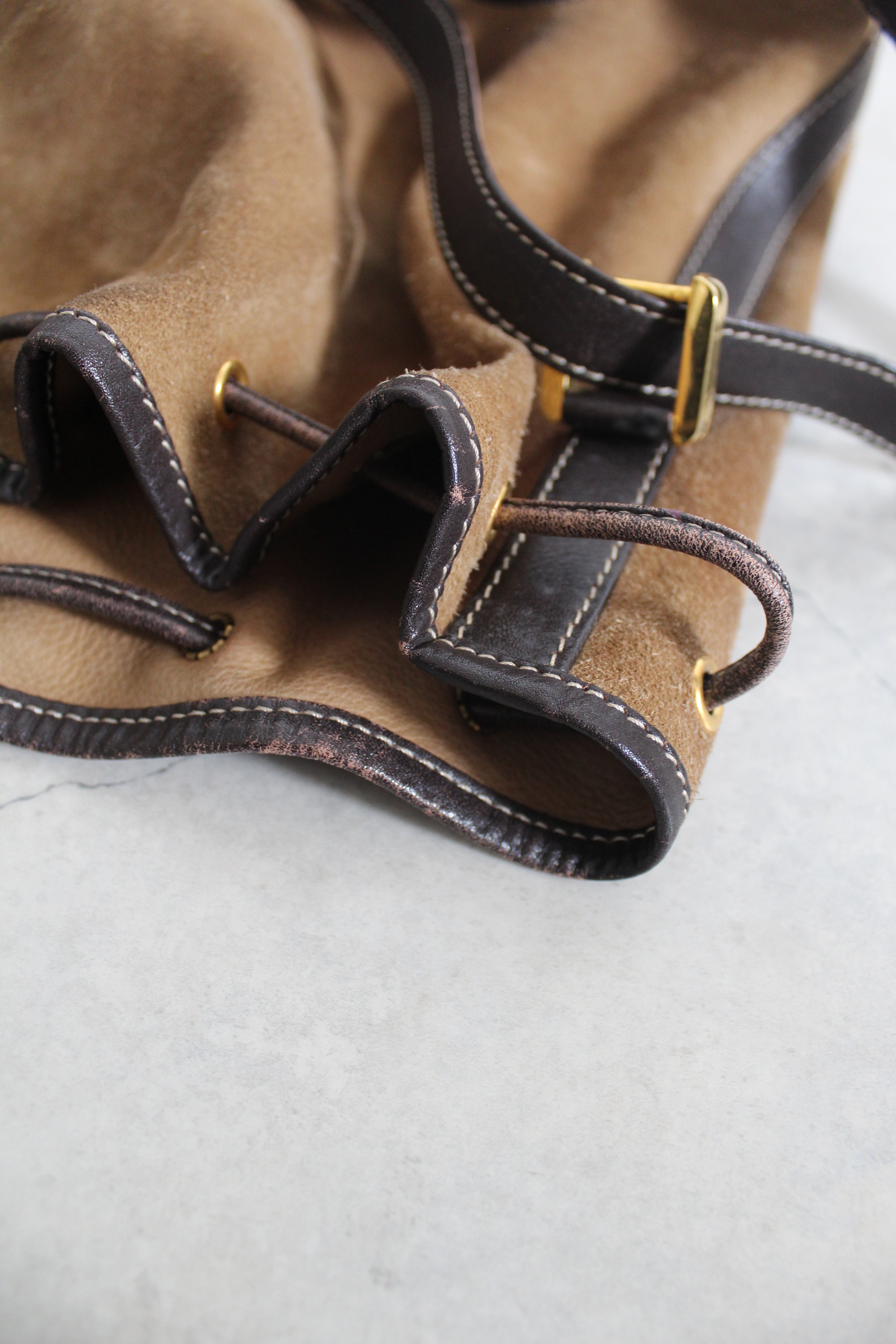 Anagram Suede Drawstring Bucket Bag