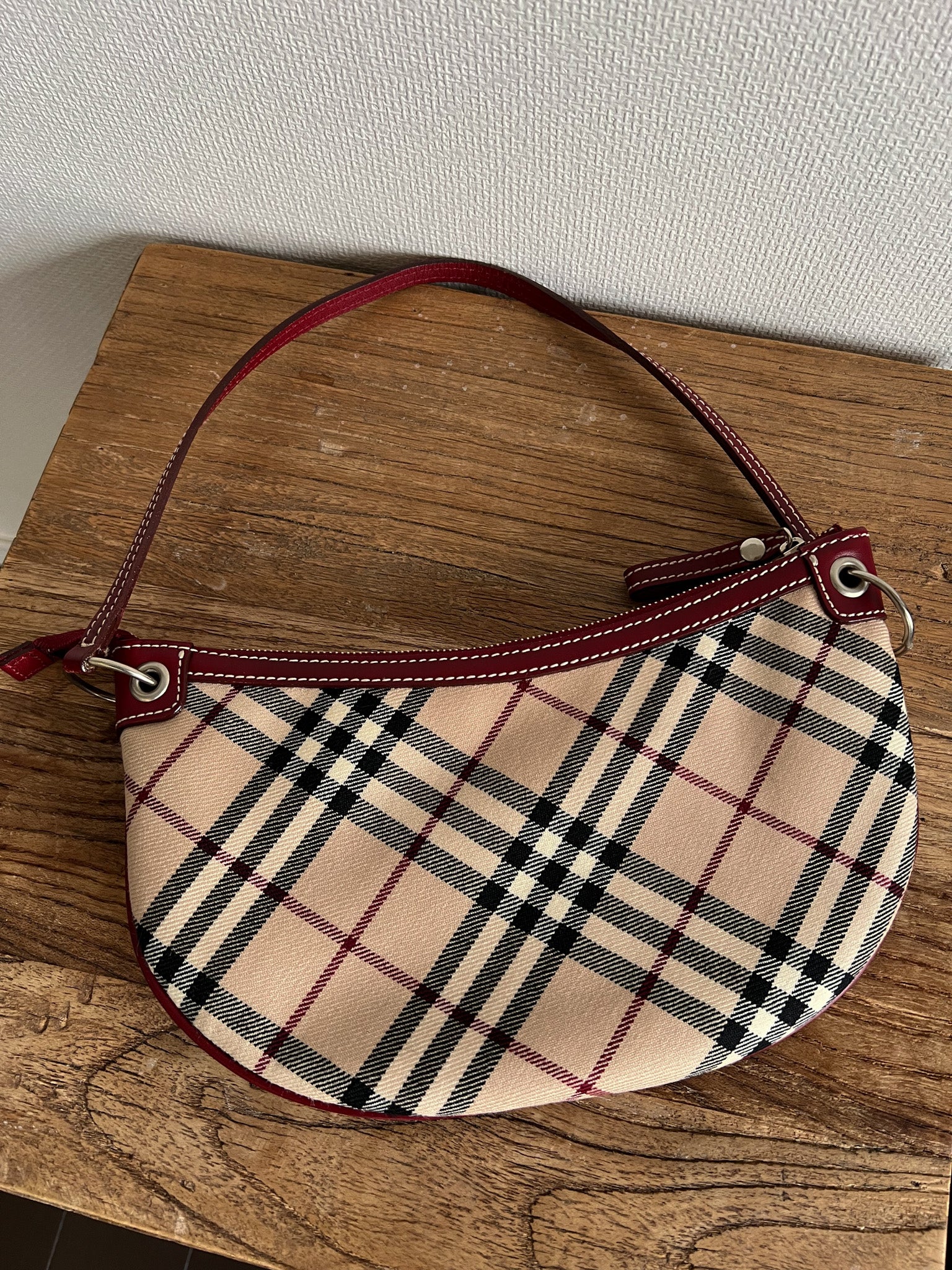 Nova Check Crescent-Shaped Accessory Pouch in Burgundy