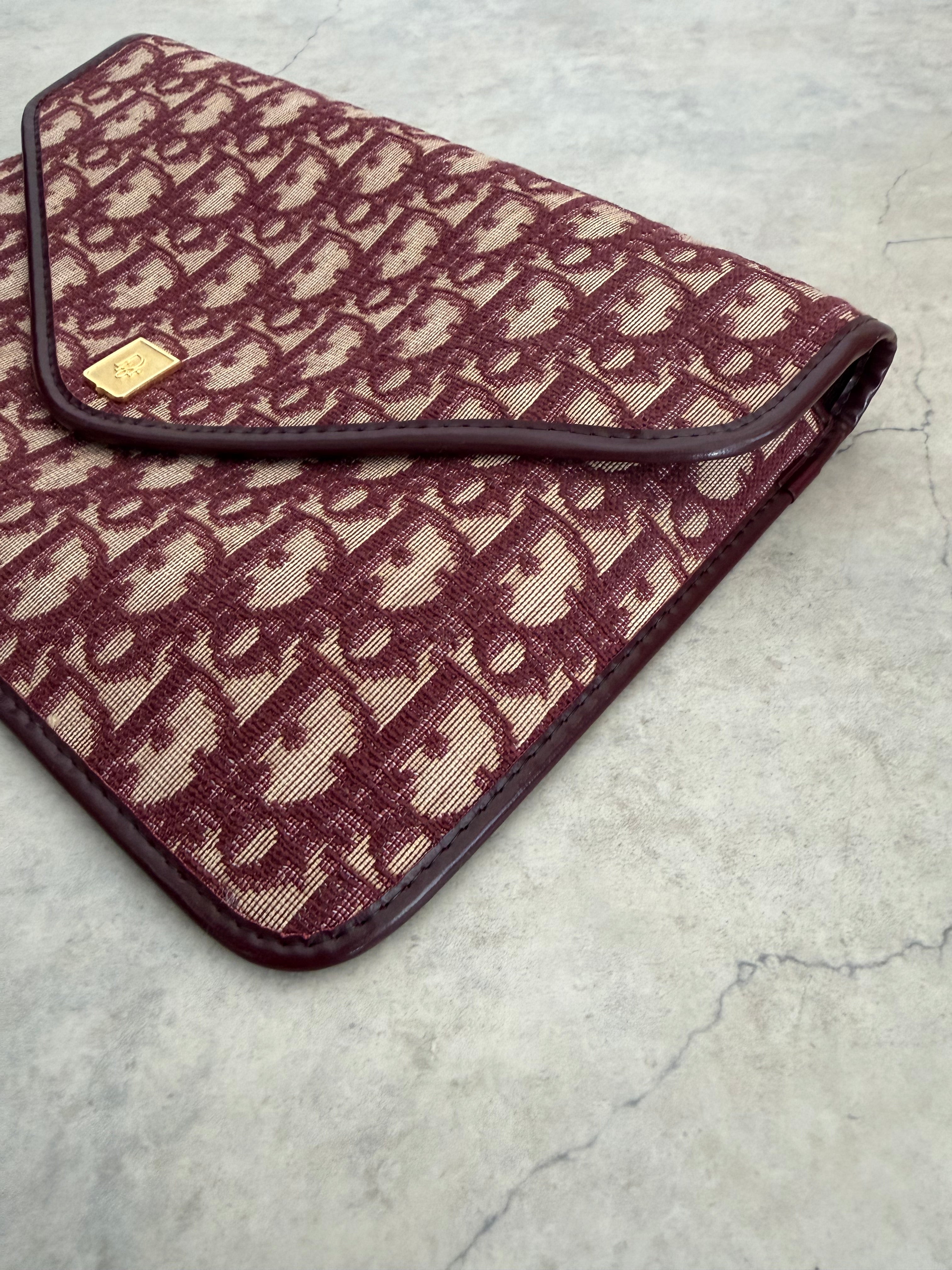 Oblique trotter flap top envelope clutch