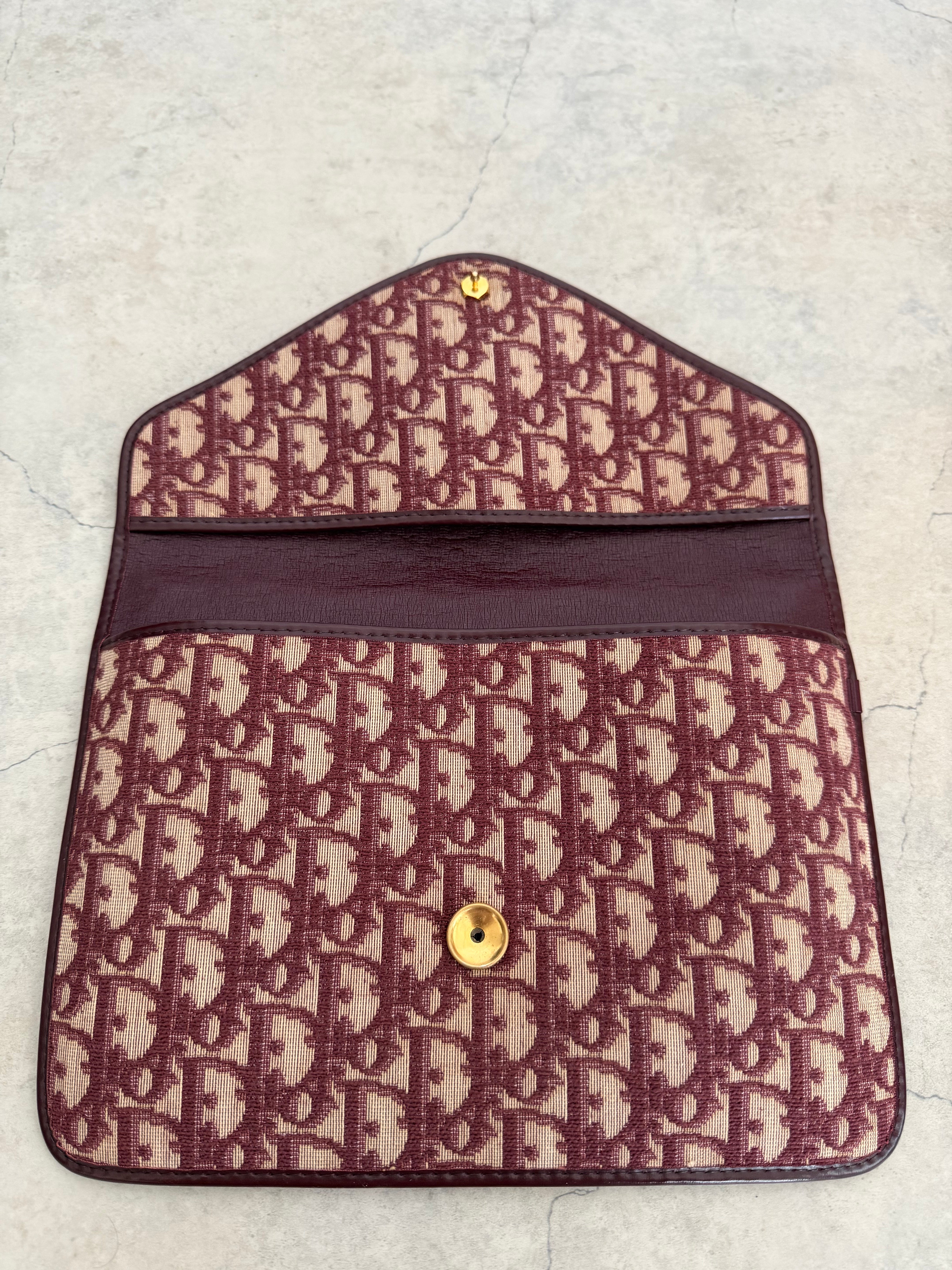 Oblique trotter flap top envelope clutch