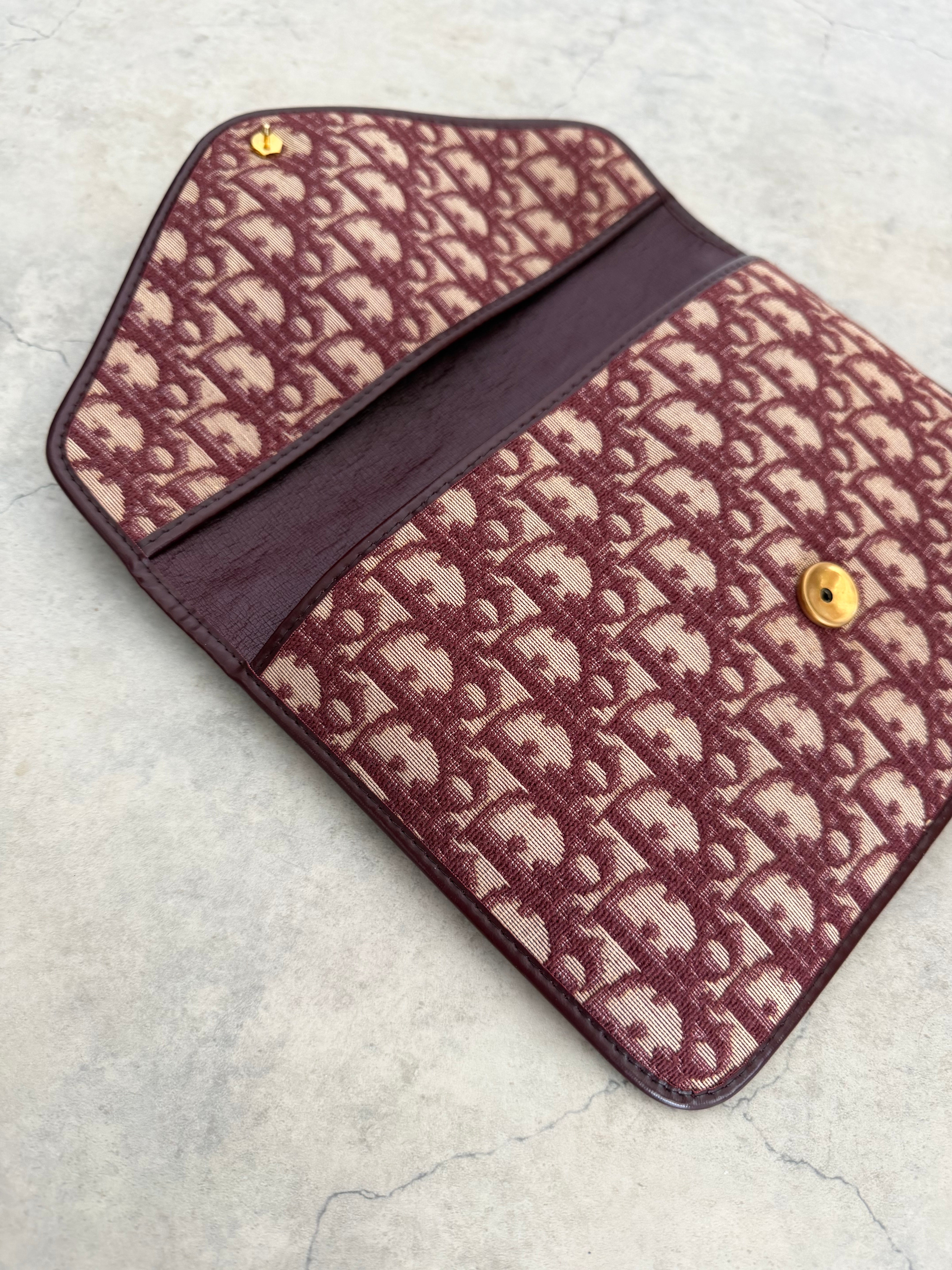 Oblique trotter flap top envelope clutch