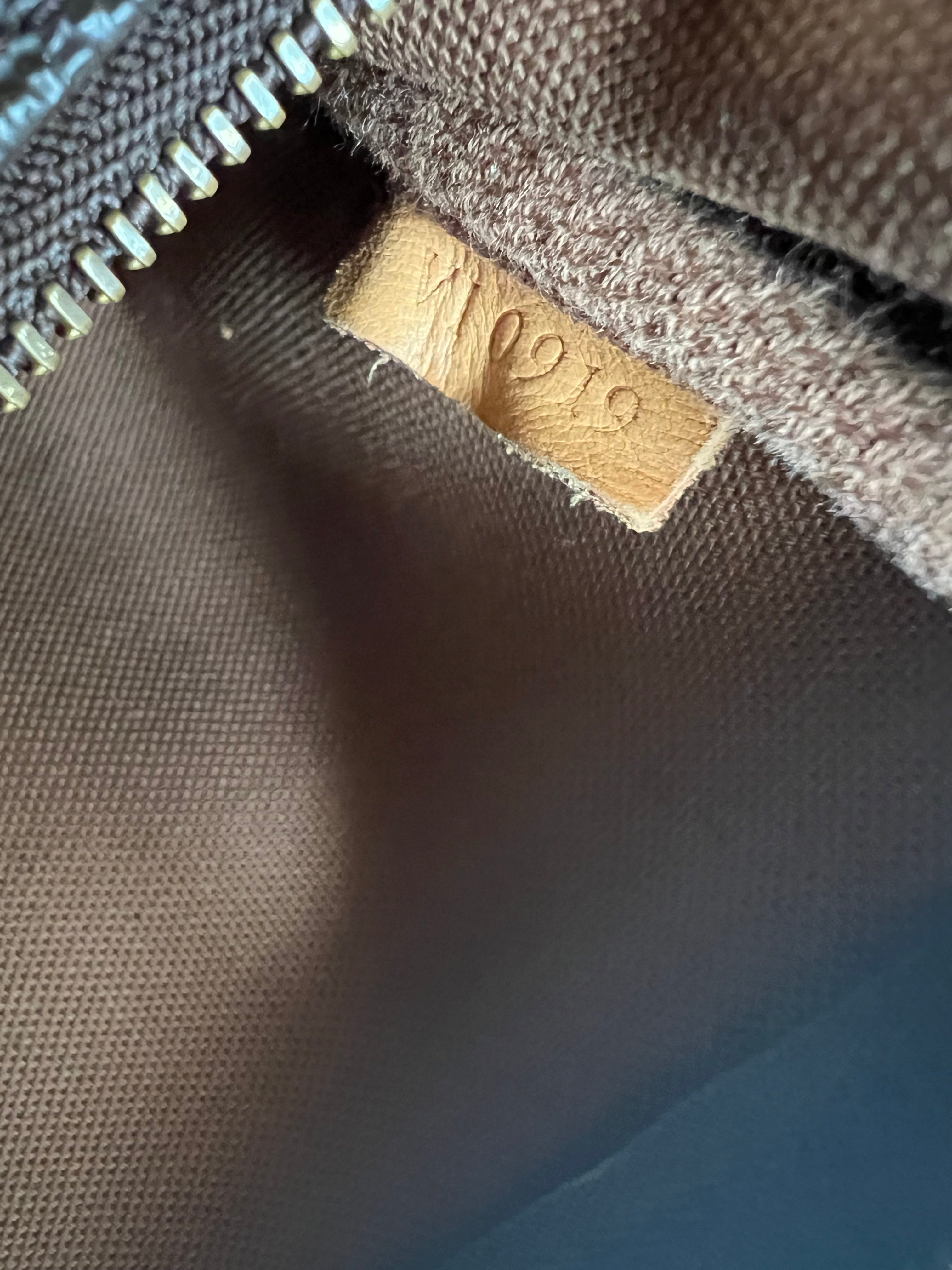 Pochette Accessoires Monogram Canvas (M82766) with a bag charm