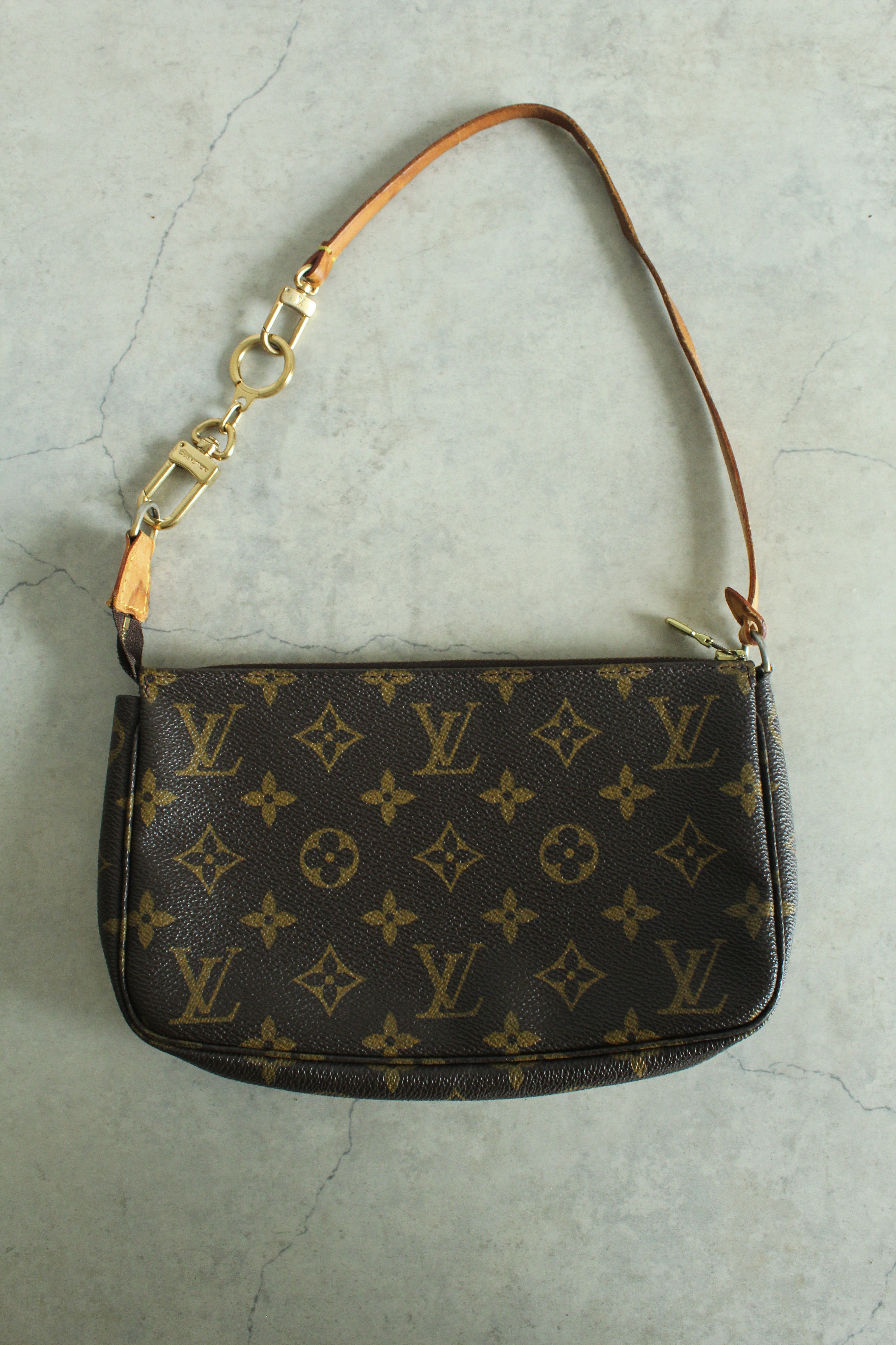 Pochette Accessoires Monogram Canvas (M82766) with a bag charm