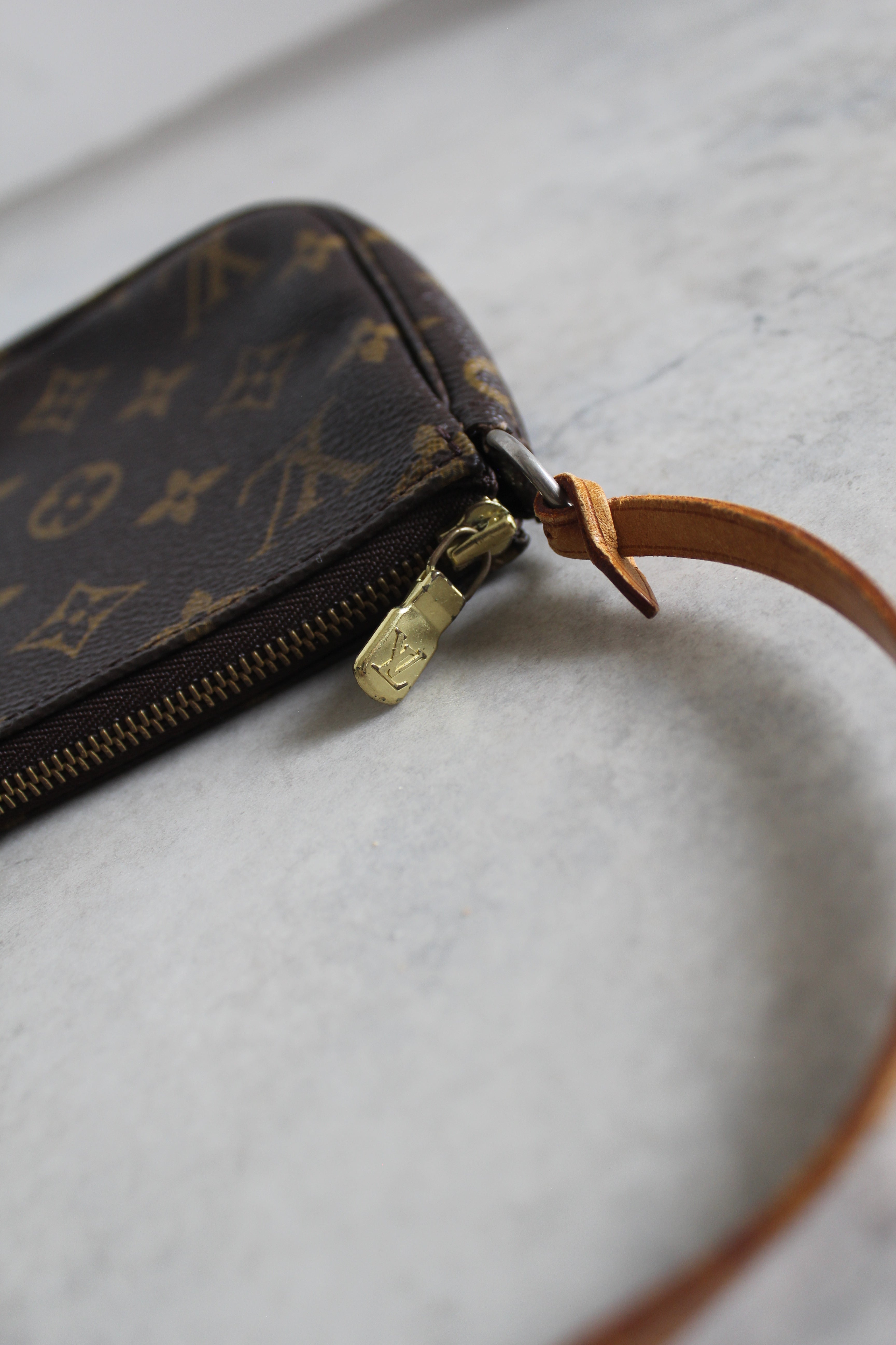 Pochette Accessoires Monogram Canvas (M82766) with a bag charm