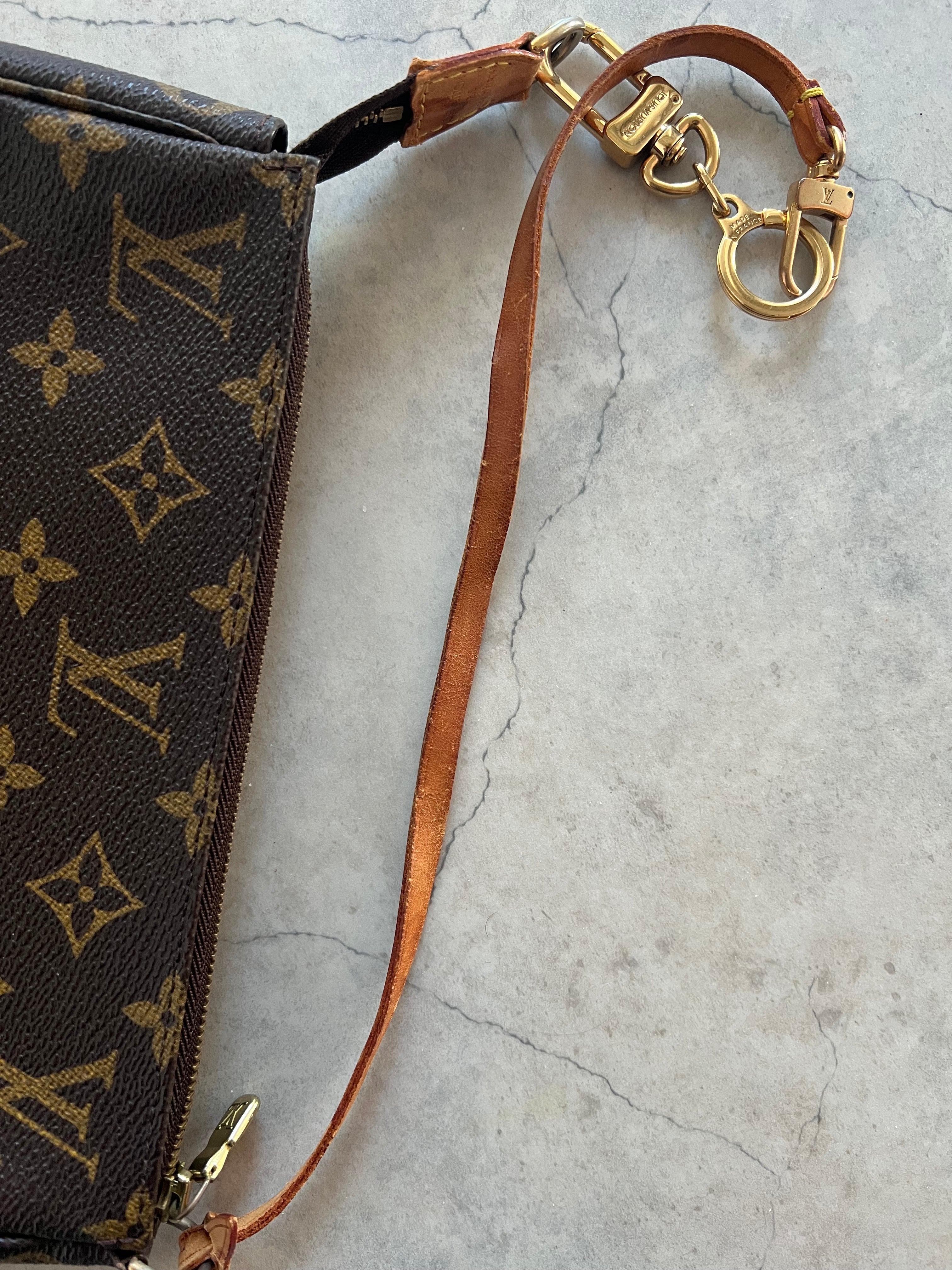 Pochette Accessoires Monogram Canvas (M82766) with a bag charm