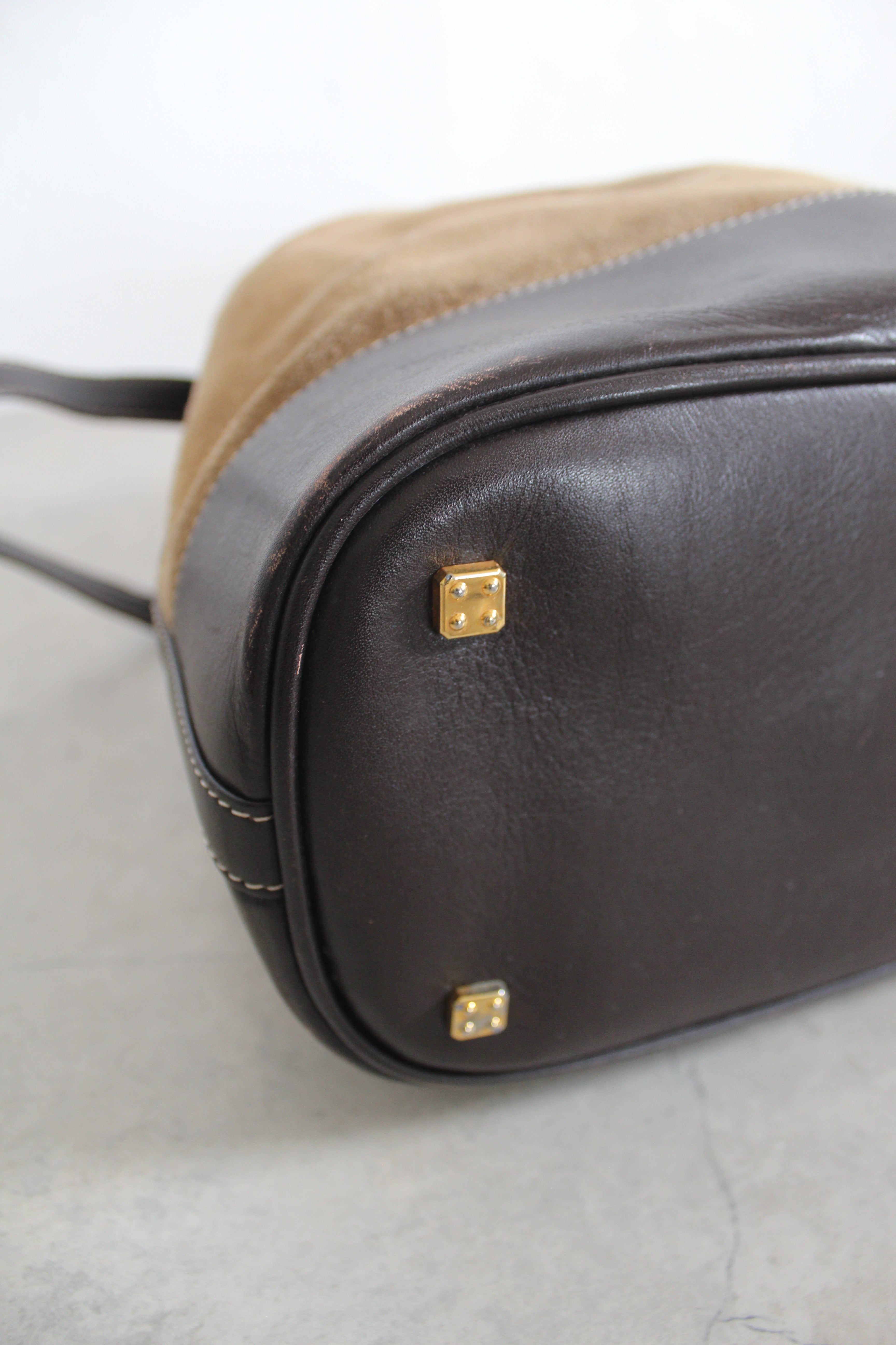 Anagram Suede Drawstring Bucket Bag