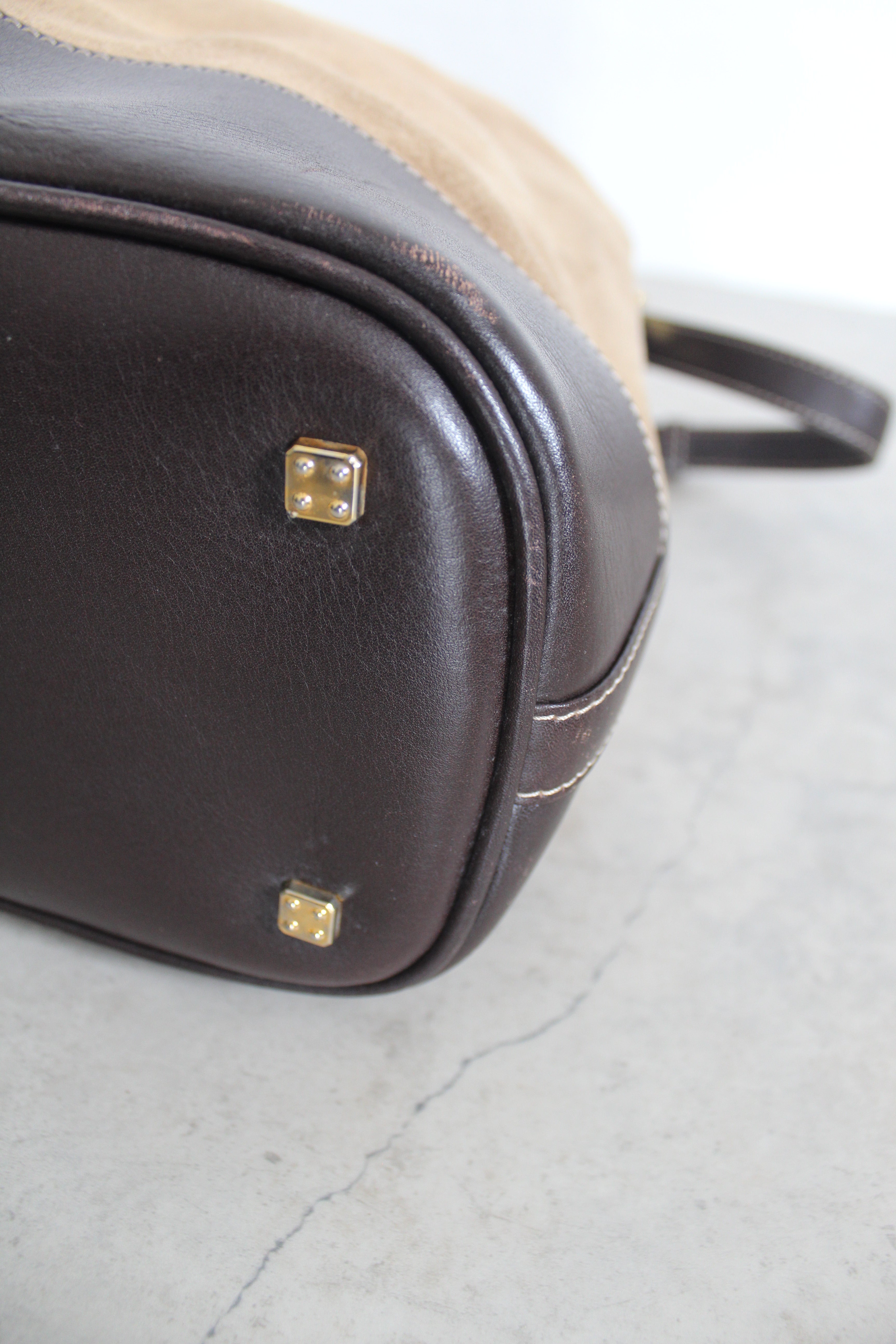 Anagram Suede Drawstring Bucket Bag