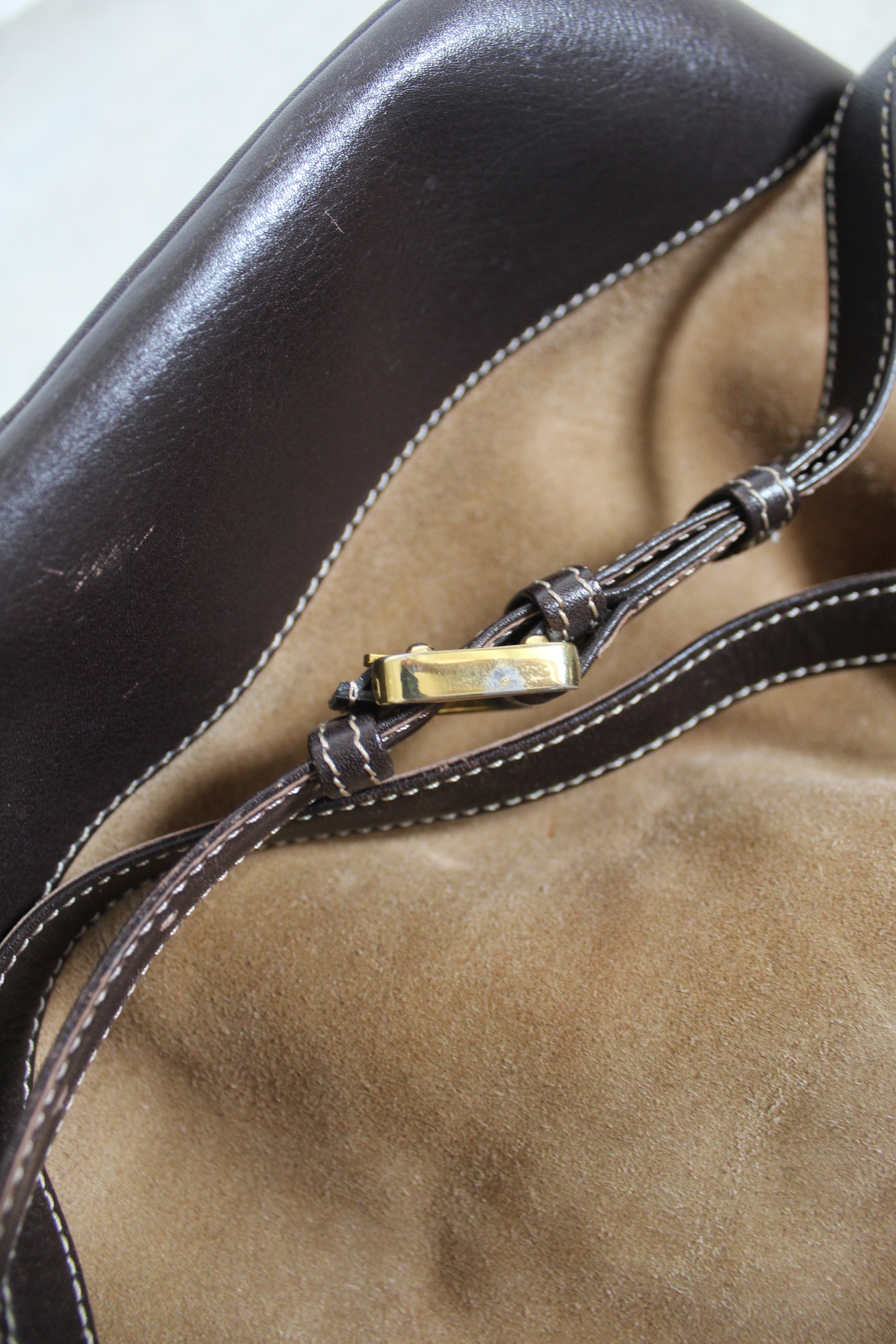 Anagram Suede Drawstring Bucket Bag