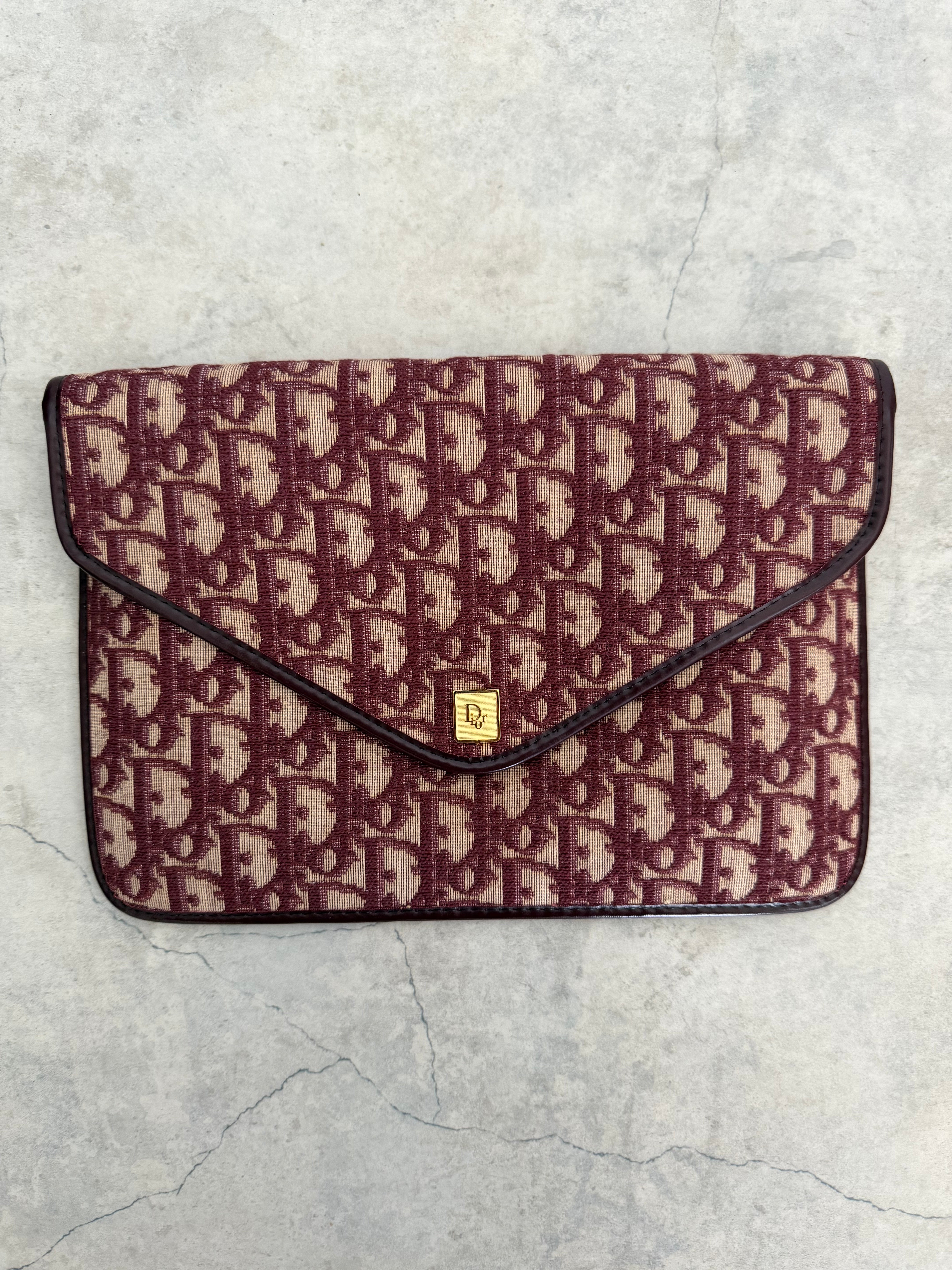 Oblique trotter flap top envelope clutch