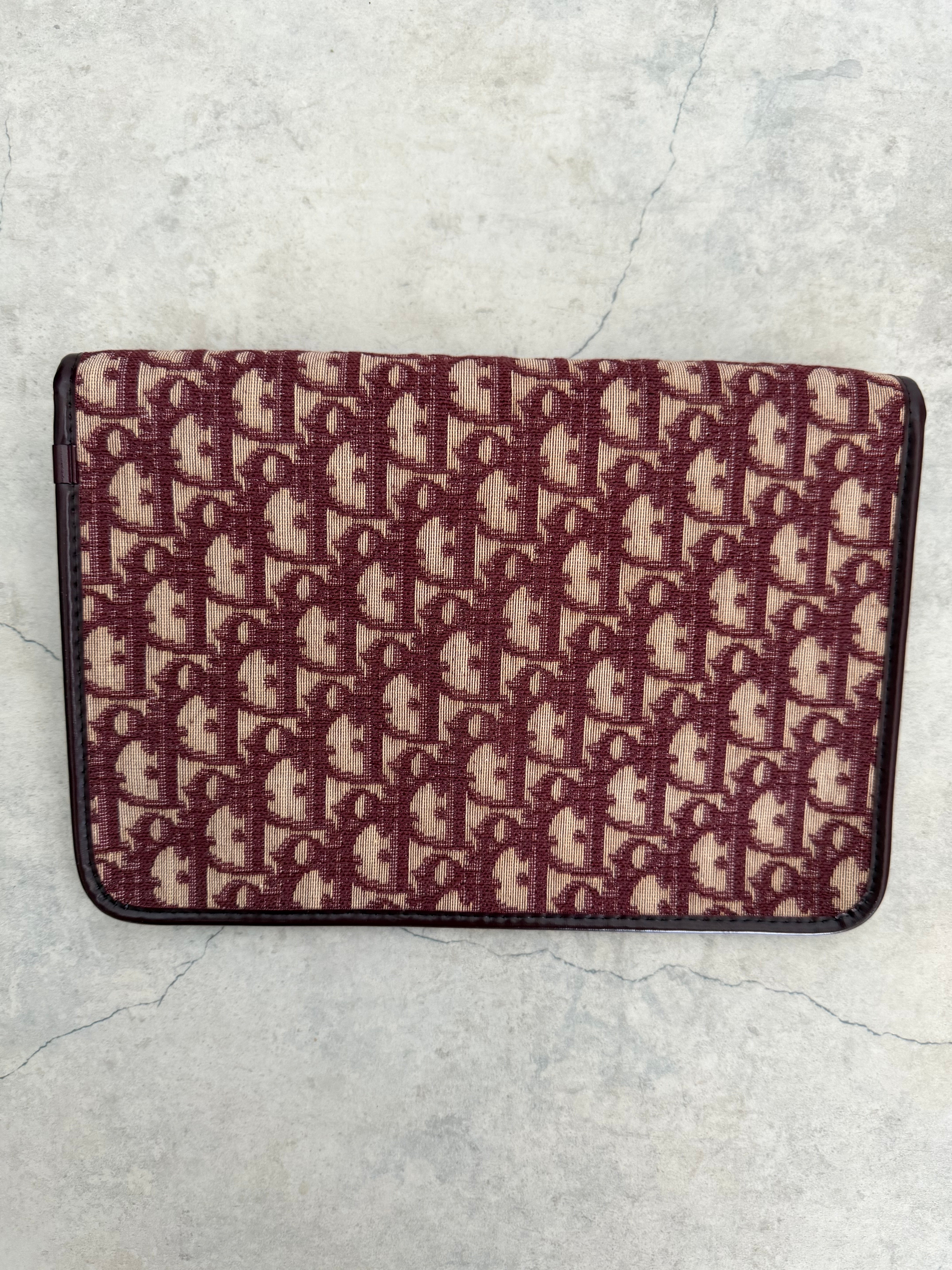 Oblique trotter flap top envelope clutch