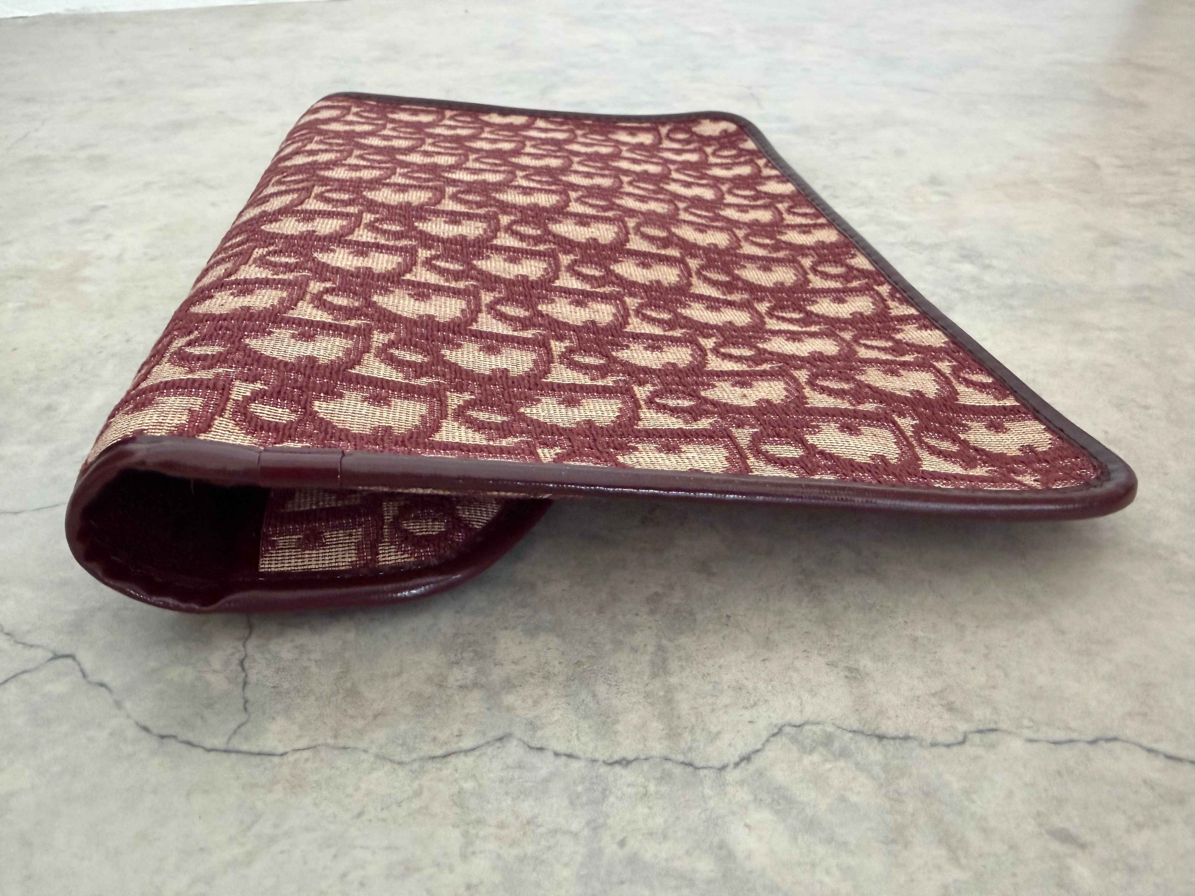 Oblique trotter flap top envelope clutch